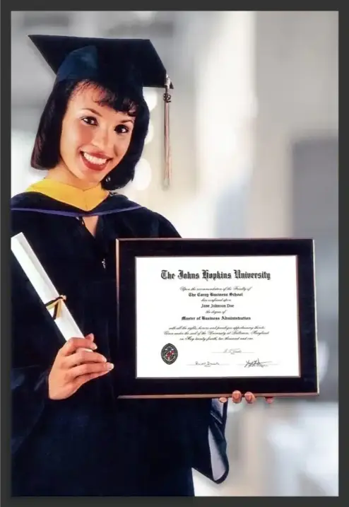 Female graduate showcasing her beautiful laminated diploma plaque. Laminated plaques near me
